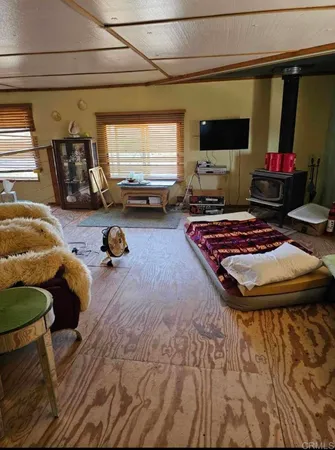 a room with furniture and a flat screen tv