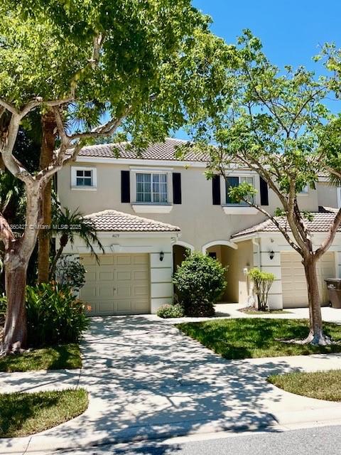4619 Palmbrooke Circle, Unit 4619 West Palm Beach, FL 33417 - Photo 1 of 15 a house with trees in the background