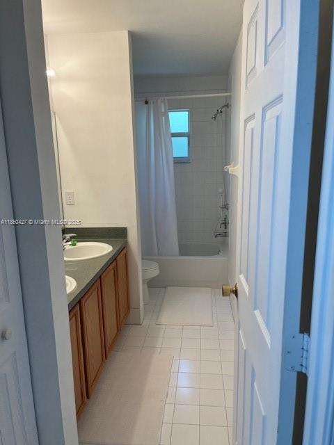 4619 Palmbrooke Circle, Unit 4619 West Palm Beach, FL 33417 - Photo 11 of 15 a bathroom with a sink a toilet and shower