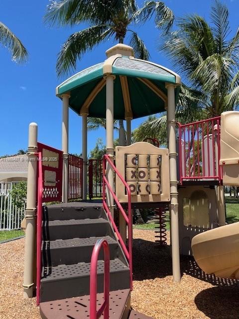 4619 Palmbrooke Circle, Unit 4619 West Palm Beach, FL 33417 - Photo 15 of 15 a view of entryway with outdoor seating