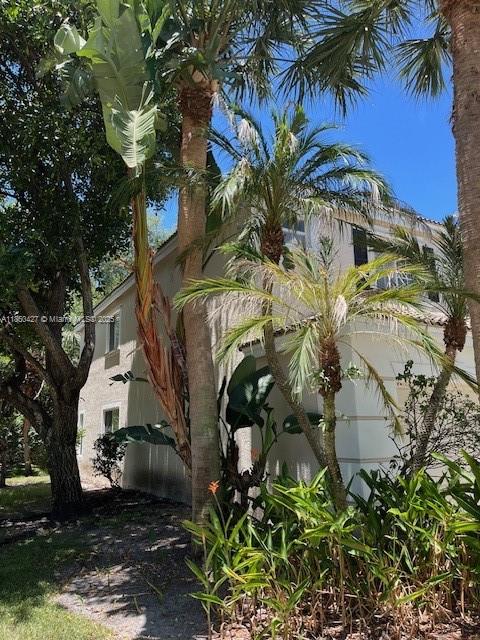 4619 Palmbrooke Circle, Unit 4619 West Palm Beach, FL 33417 - Photo 5 of 15 a view of a house with a yard and sitting area