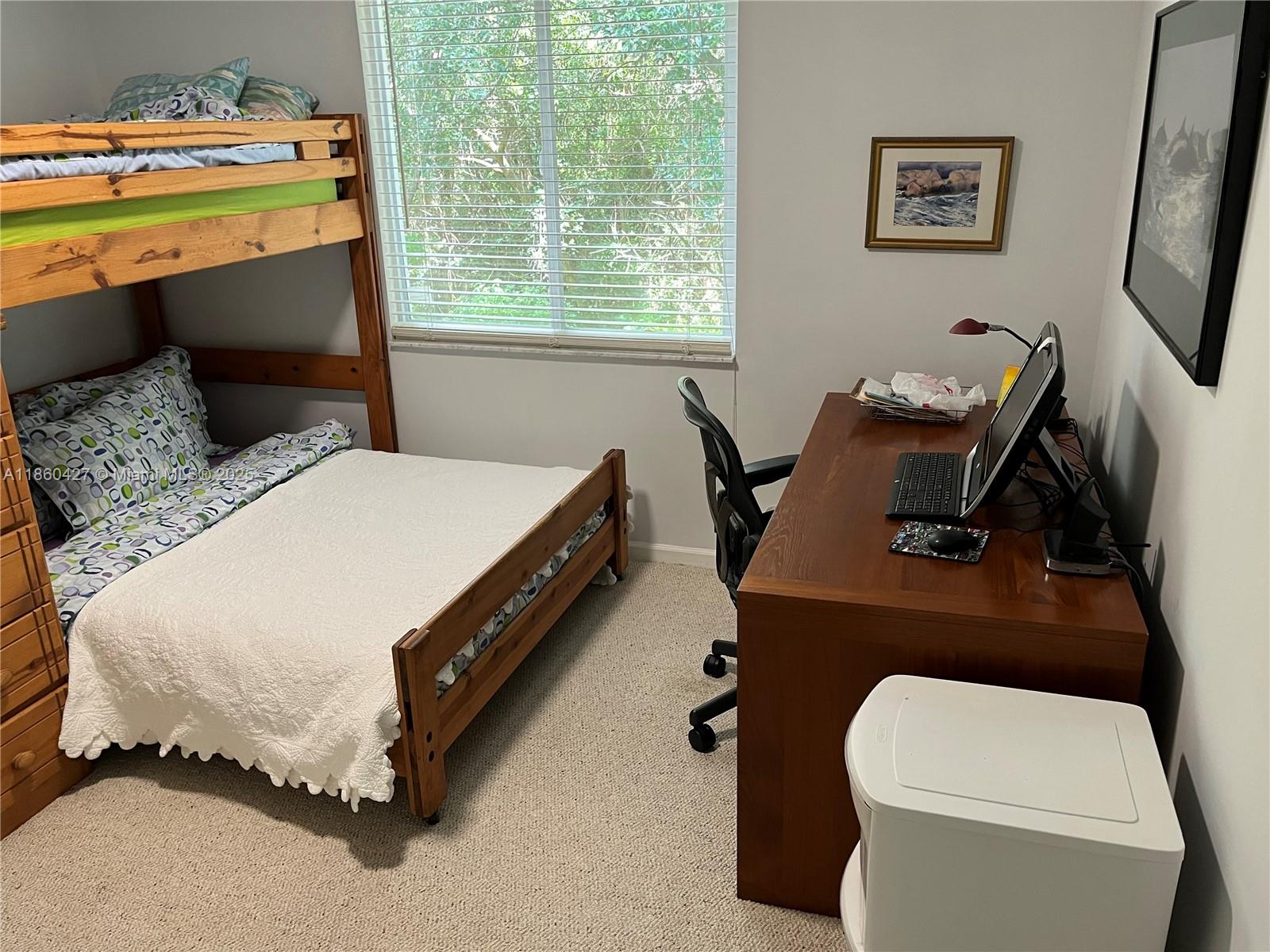 4619 Palmbrooke Circle, Unit 4619 West Palm Beach, FL 33417 - Photo 10 of 15 a bedroom with a bed and a window