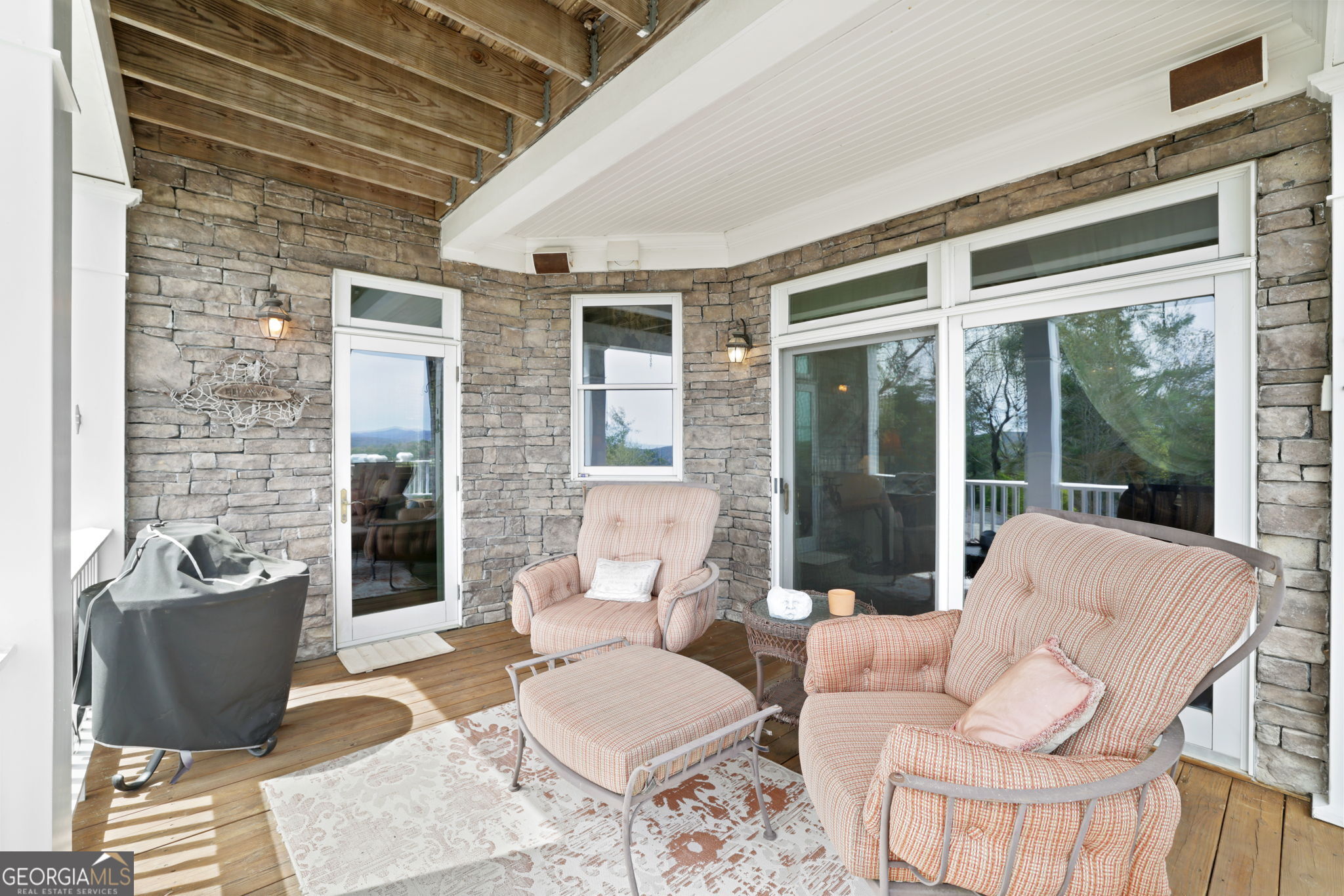 1171 Rabun Bluffs Drive Lakemont, GA 30552 - Photo 23 of 75 a living room with furniture and a floor to ceiling window