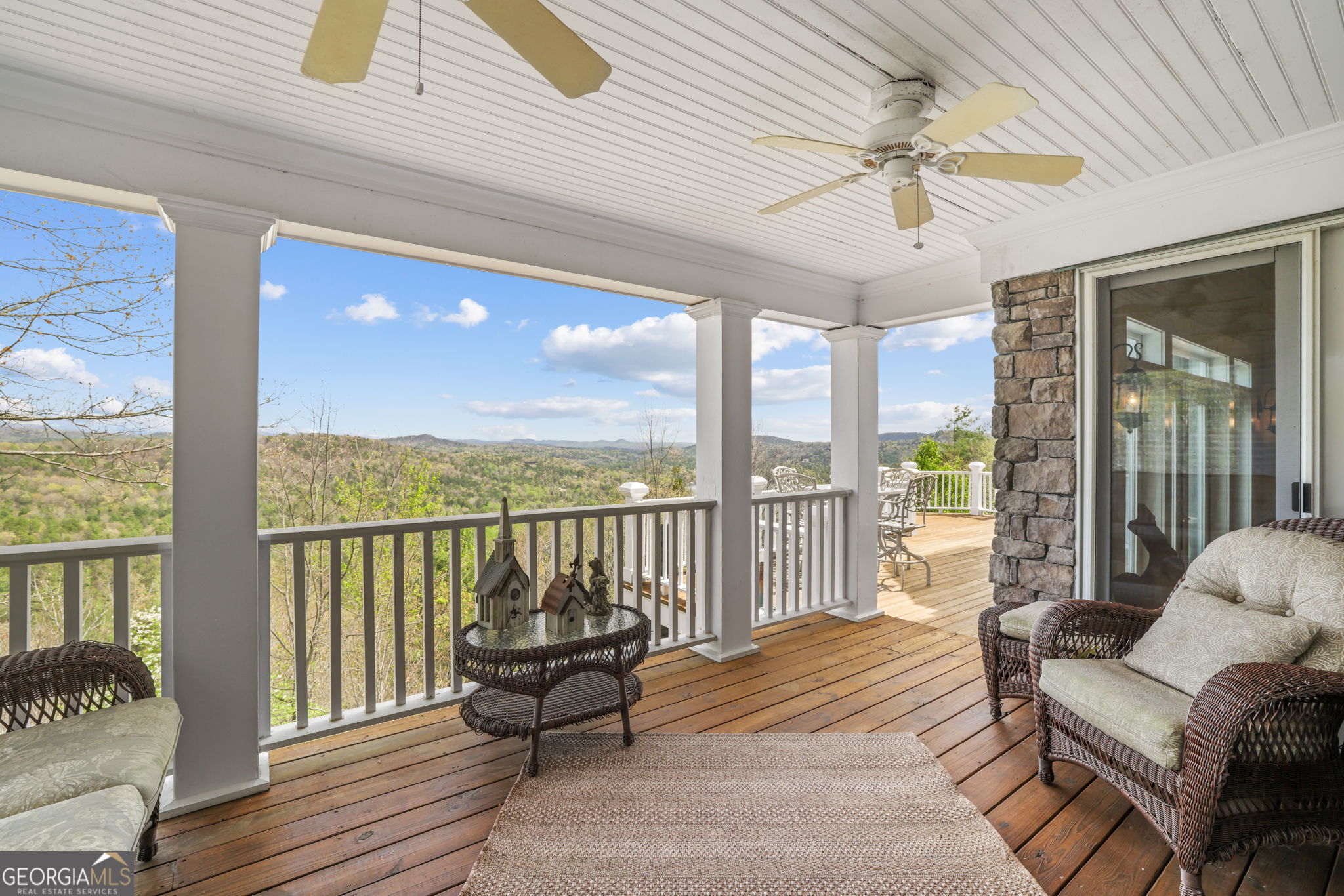1171 Rabun Bluffs Drive Lakemont, GA 30552 - Photo 26 of 75 a balcony with furniture and a potted plant