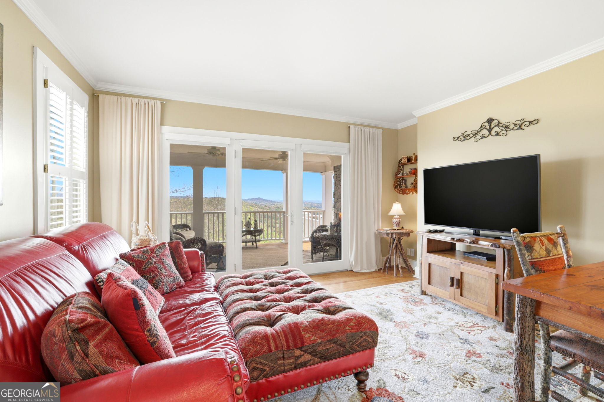 1171 Rabun Bluffs Drive Lakemont, GA 30552 - Photo 29 of 75 a living room with furniture and a flat screen tv