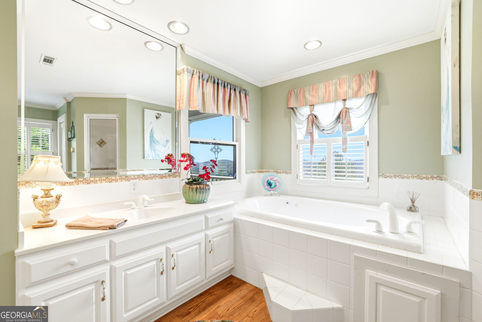 1171 Rabun Bluffs Drive Lakemont, GA 30552 - Photo 32 of 75 a bathroom with a tub sink and mirror