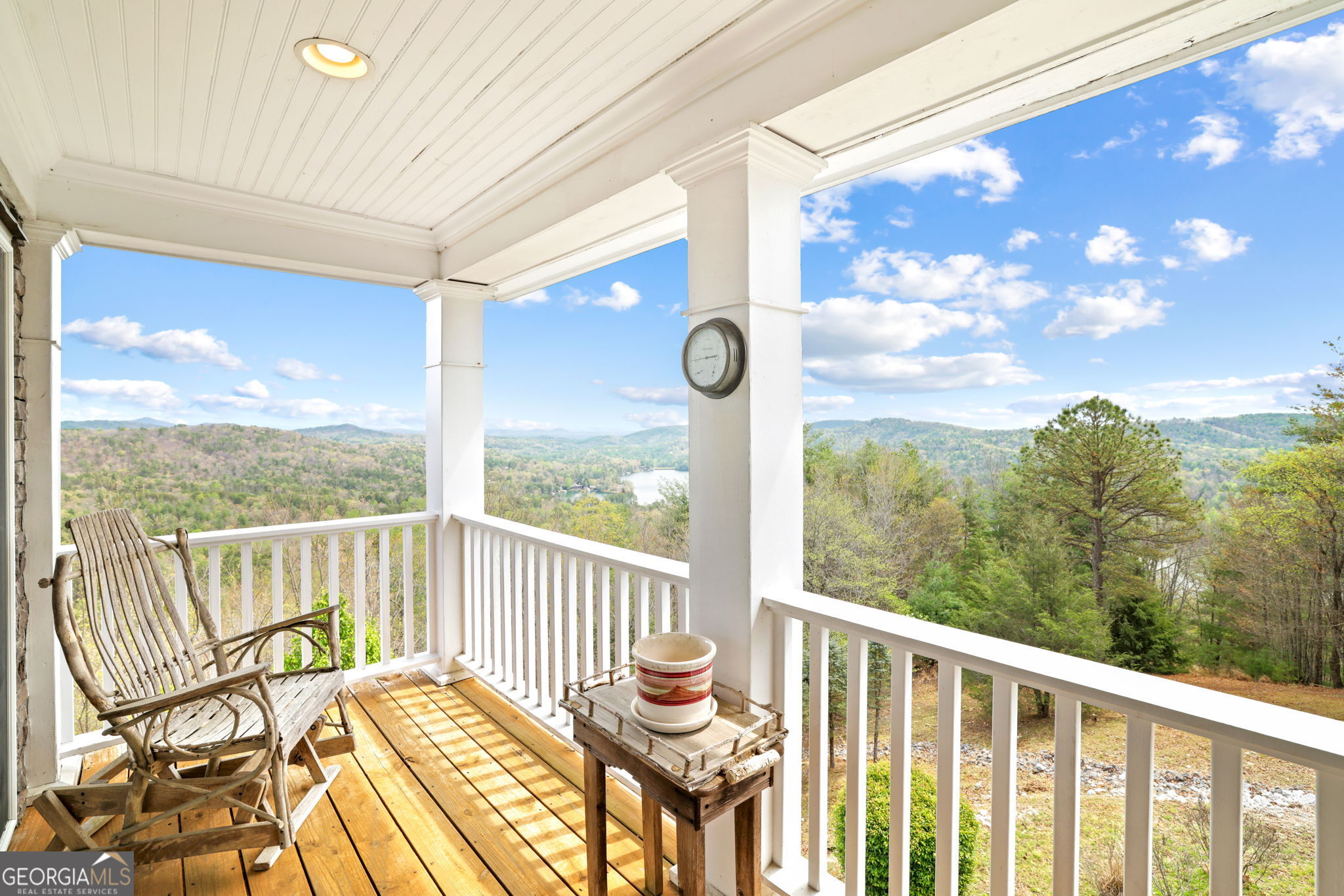 1171 Rabun Bluffs Drive Lakemont, GA 30552 - Photo 36 of 75 a view of a balcony with chair and wooden floor
