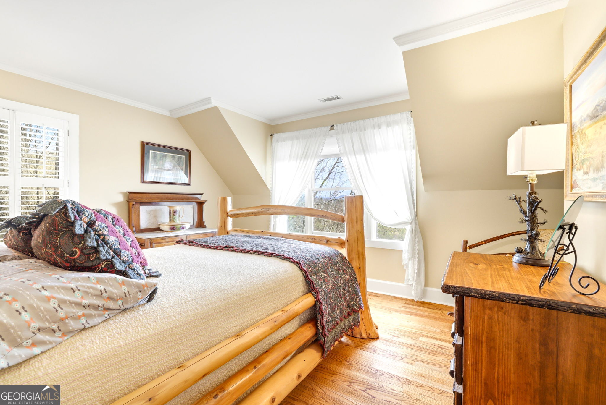 1171 Rabun Bluffs Drive Lakemont, GA 30552 - Photo 43 of 75 a bedroom with a bed and wooden floor