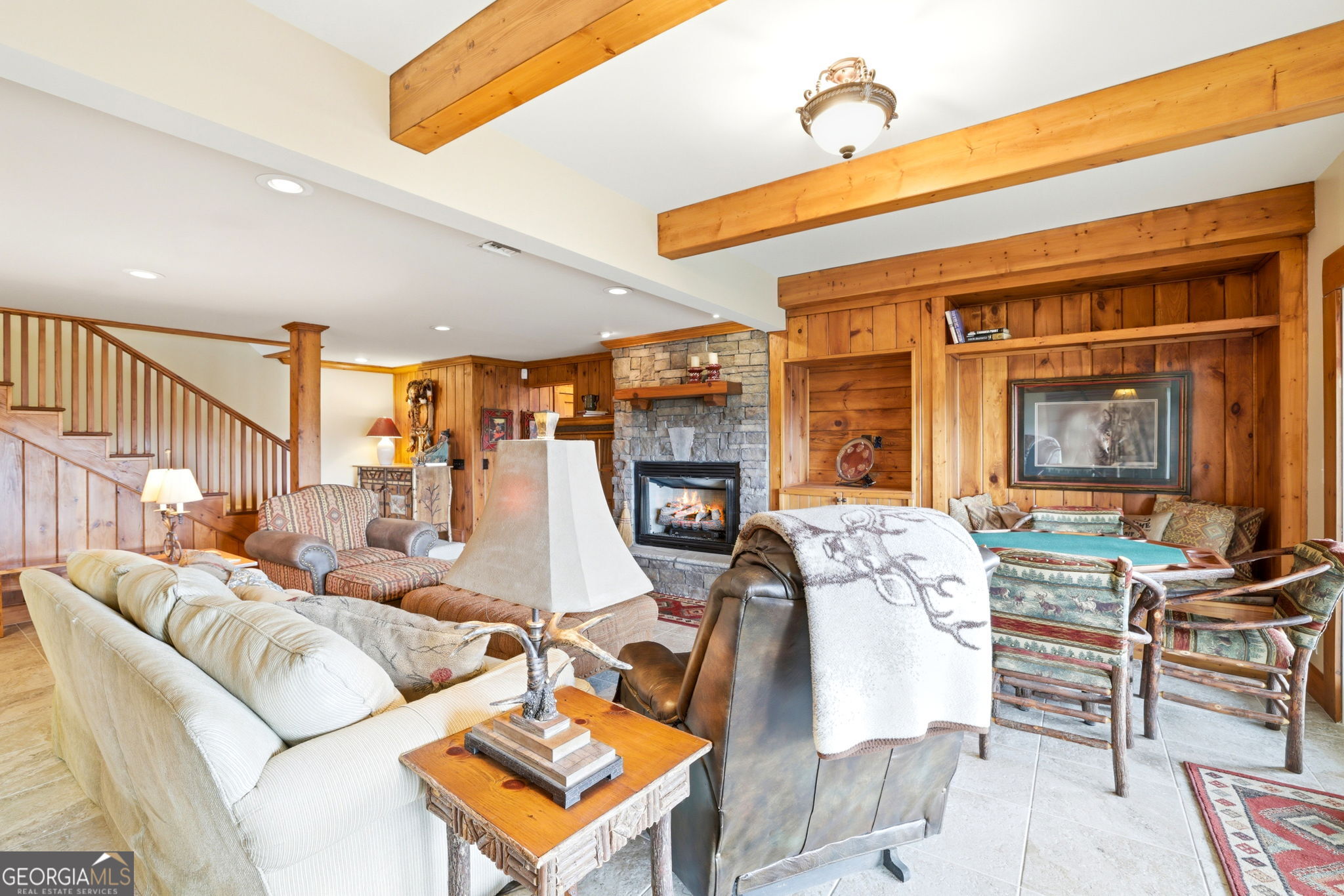 1171 Rabun Bluffs Drive Lakemont, GA 30552 - Photo 48 of 75 a living room with furniture a fireplace and a flat screen tv