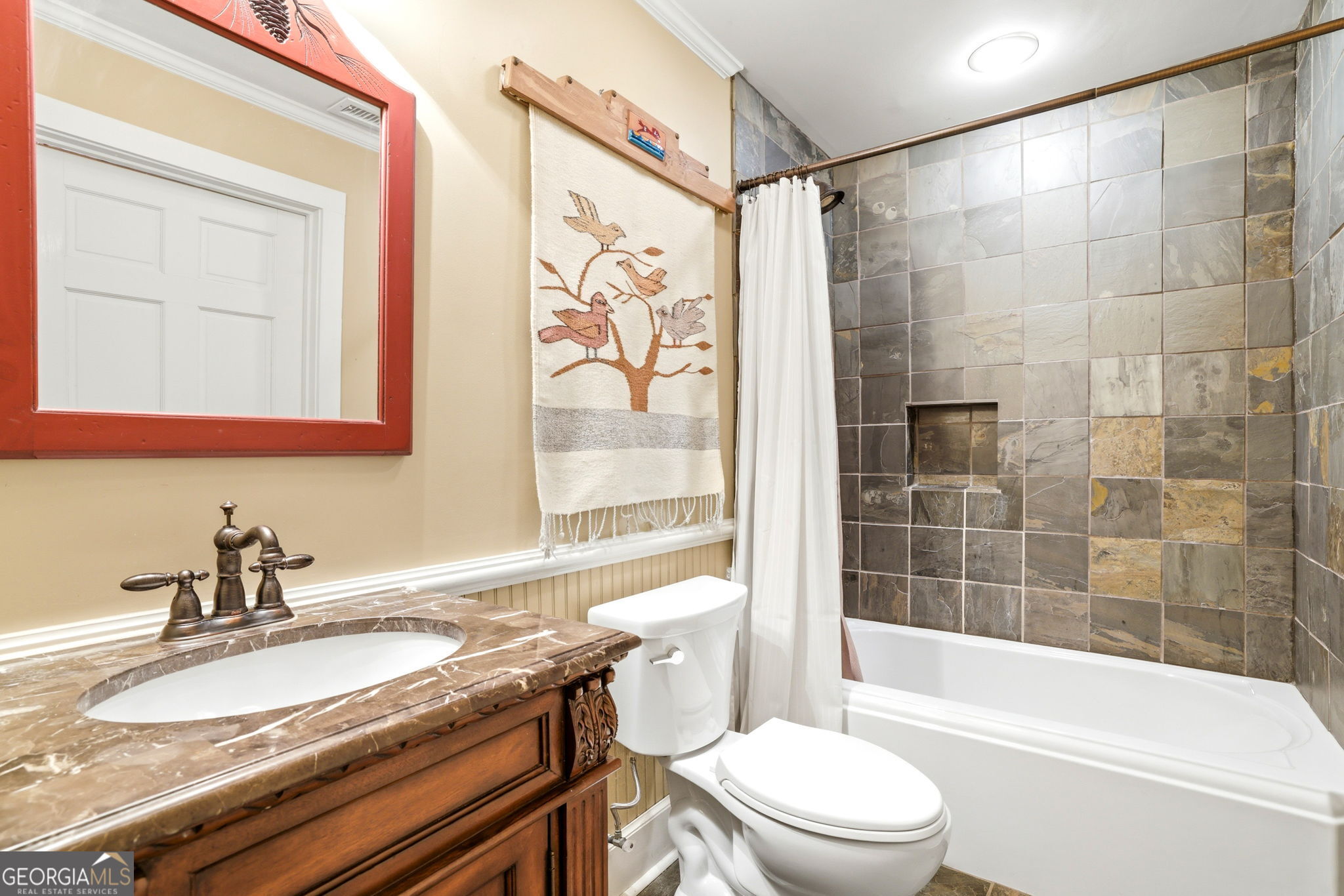 1171 Rabun Bluffs Drive Lakemont, GA 30552 - Photo 57 of 75 a bathroom with a granite countertop sink a toilet and shower