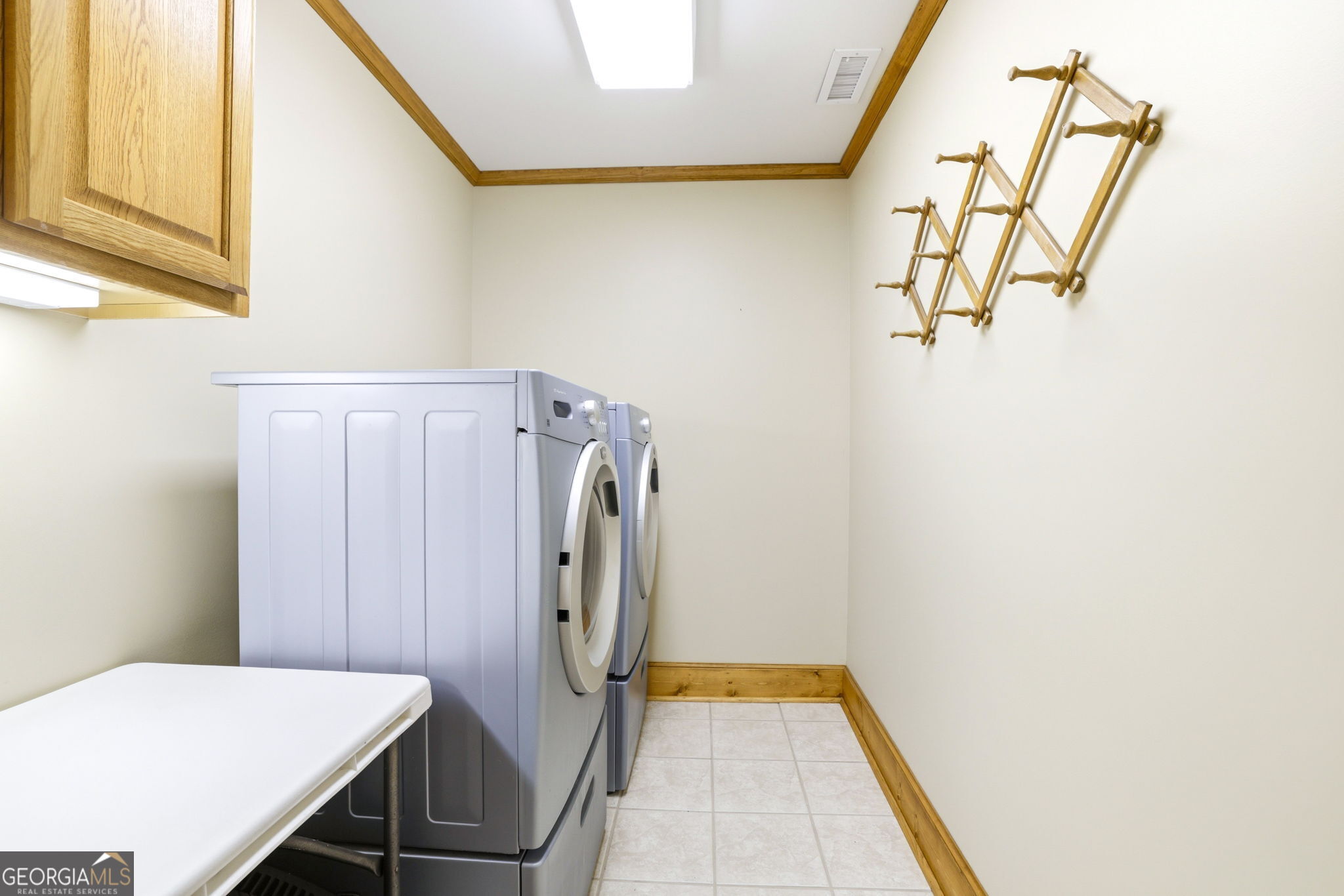 1171 Rabun Bluffs Drive Lakemont, GA 30552 - Photo 66 of 75 a view of a storage & utility room with a washer and dryer