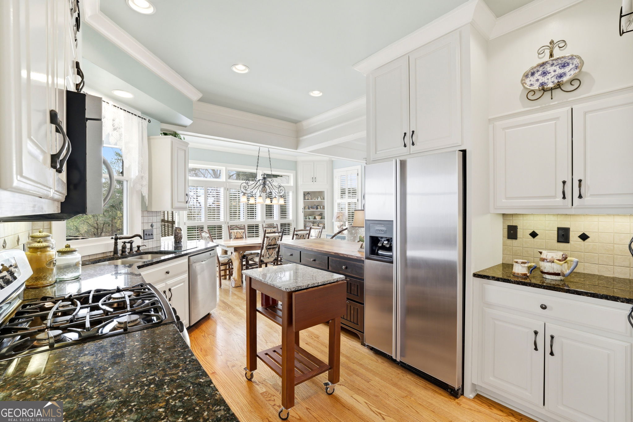 1171 Rabun Bluffs Drive Lakemont, GA 30552 - Photo 7 of 75 a kitchen with stainless steel appliances granite countertop a refrigerator a sink a stove and white cabinets