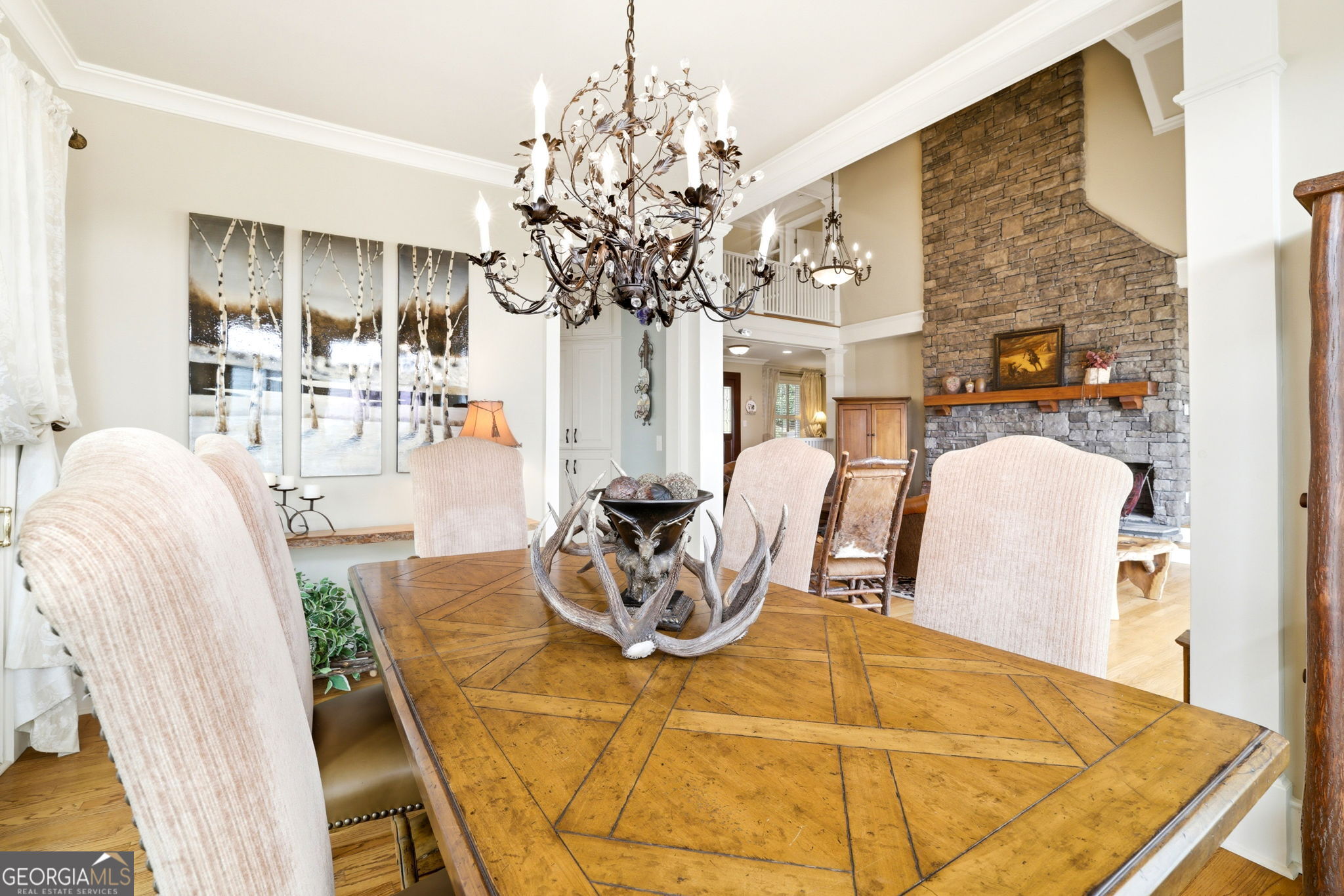 1171 Rabun Bluffs Drive Lakemont, GA 30552 - Photo 8 of 75 a living room with furniture a chandelier and a dining table