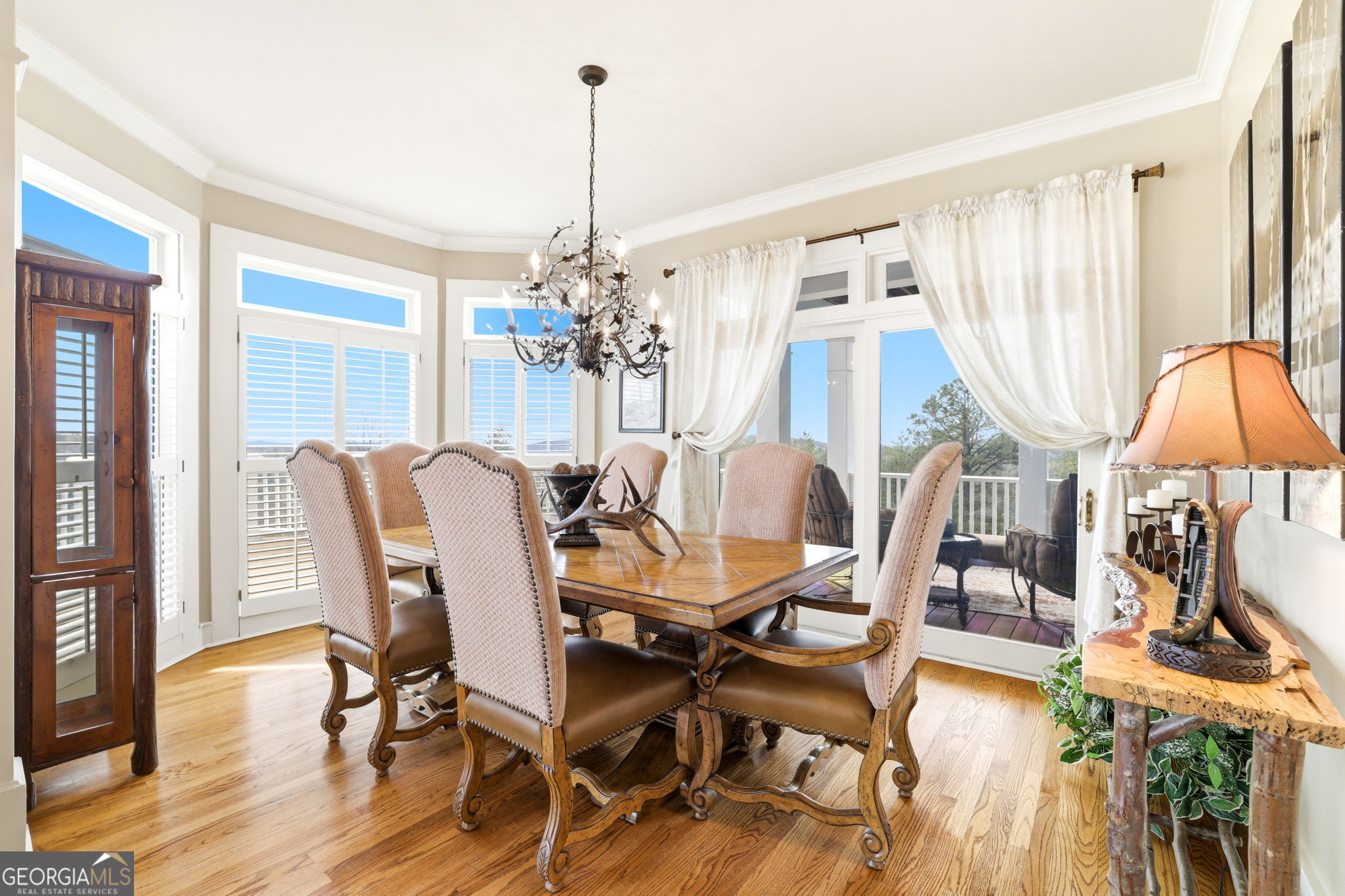 1171 Rabun Bluffs Drive Lakemont, GA 30552 - Photo 9 of 75 a view of a dining room with furniture wooden floor and chandelier