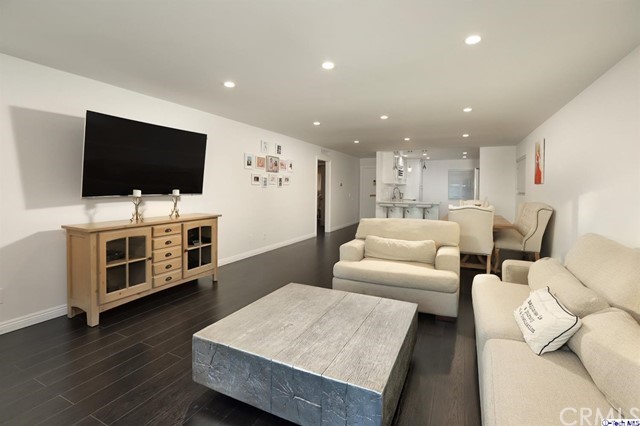 1935 Alpha Road, Unit 314 Glendale, CA 91208 - Photo 1 of 1 a living room with furniture and a flat screen tv