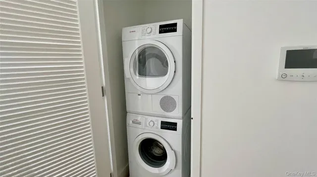 a work room with furniture and a potted plant