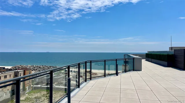 a view of roof deck with seating space