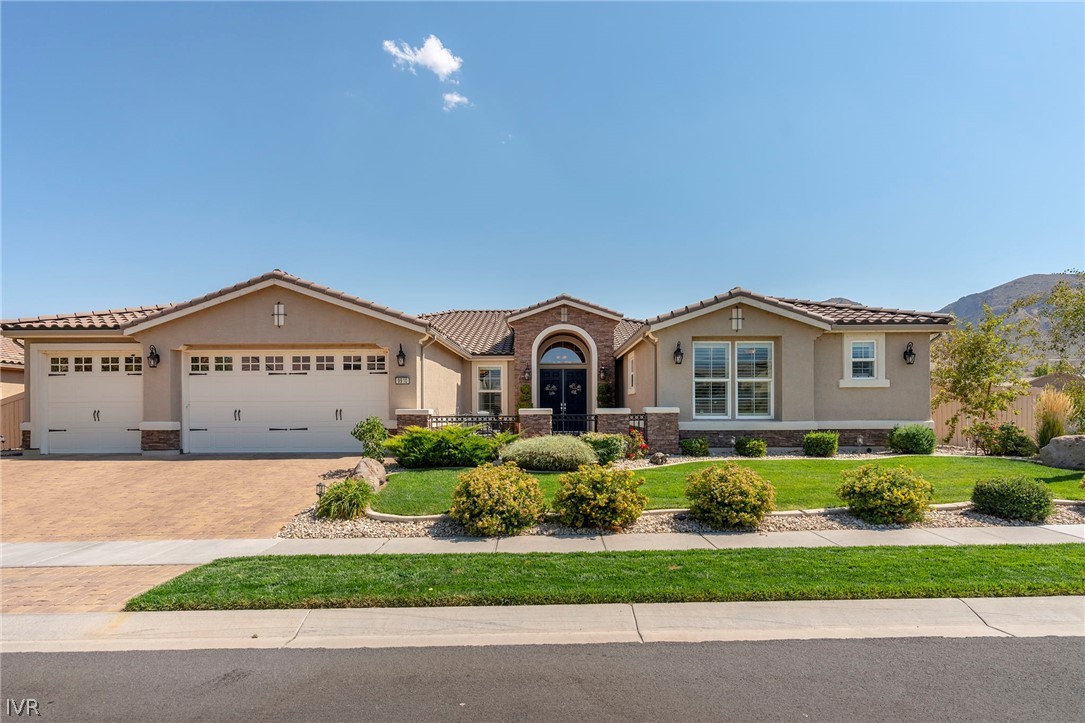 9910 Copenhagen Way Reno, NV 89521 - Photo 1 of 22 a front view of house with yard and green space