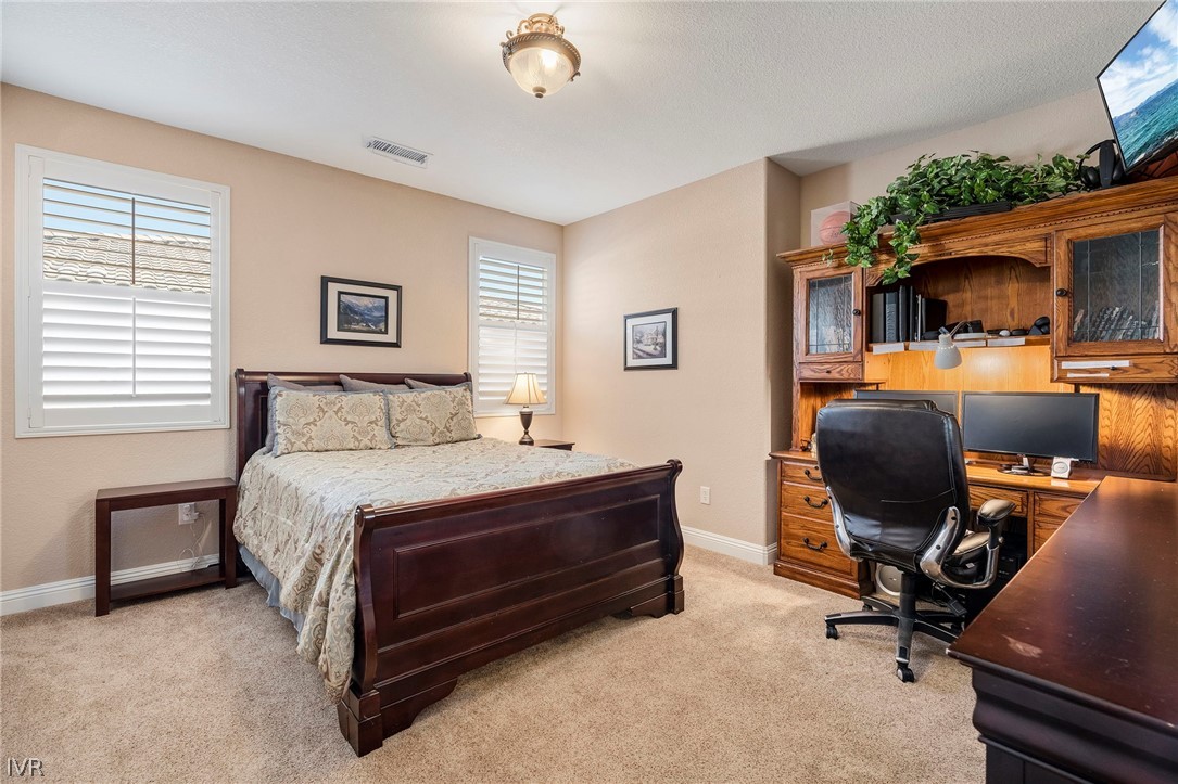 9910 Copenhagen Way Reno, NV 89521 - Photo 13 of 22 a bedroom with a bed and furniture