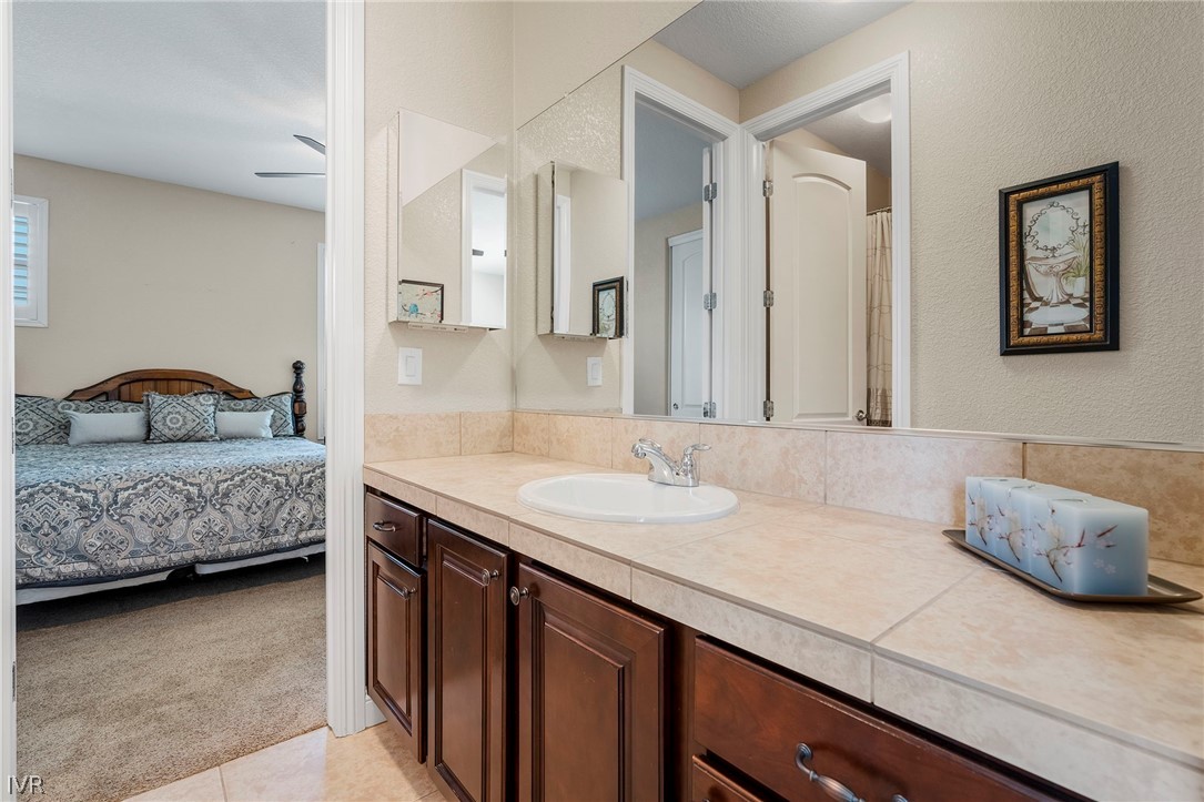 9910 Copenhagen Way Reno, NV 89521 - Photo 15 of 22 a bedroom with a bed and a mirror