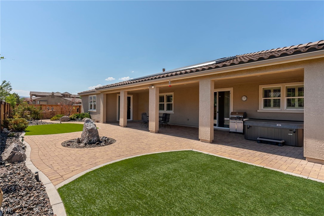 9910 Copenhagen Way Reno, NV 89521 - Photo 19 of 22 a view of a house with backyard sitting area and garden