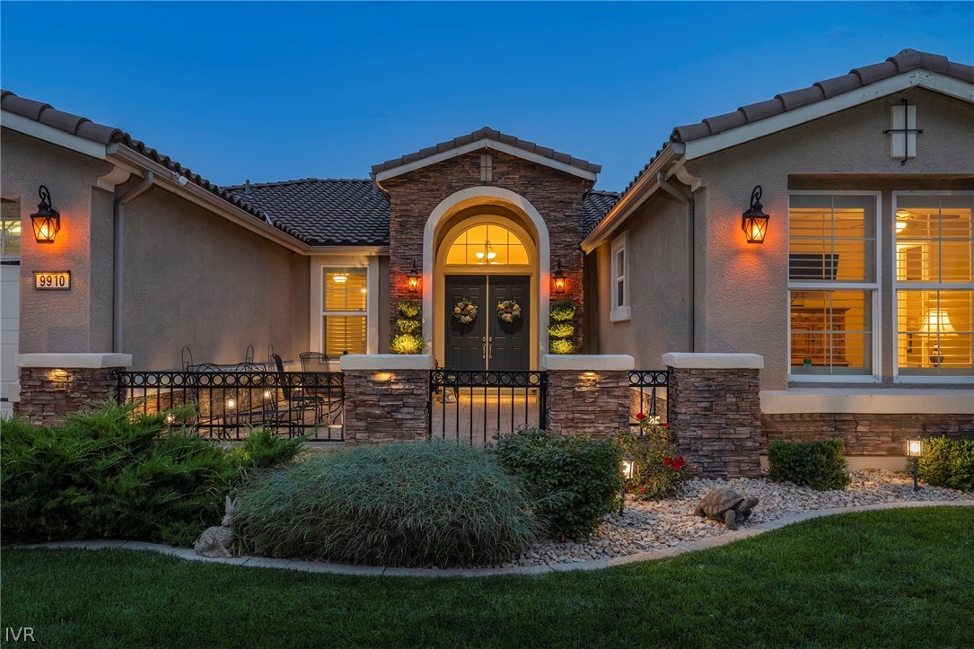 9910 Copenhagen Way Reno, NV 89521 - Photo 3 of 22 a front view of a house with garden