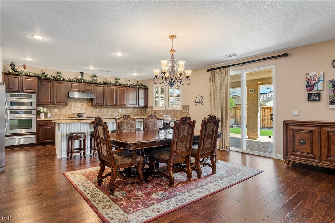 9910 Copenhagen Way Reno, NV 89521 - Photo 5 of 22 a view of a dining room with furniture window and wooden floor