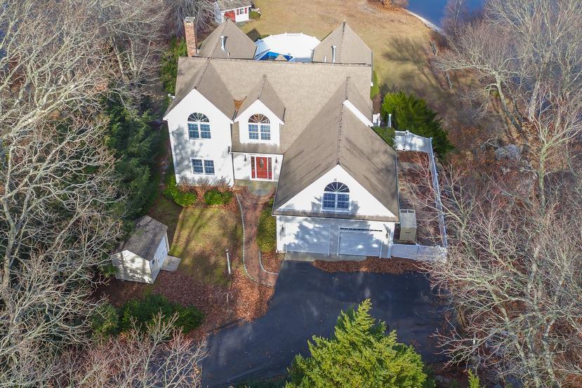 a view of a brick house with a yard