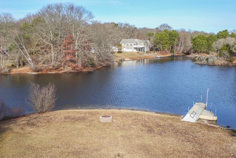 113 James Circle Mashpee, MA 02649 - Photo 23 of 29 a view of a lake with a mountain