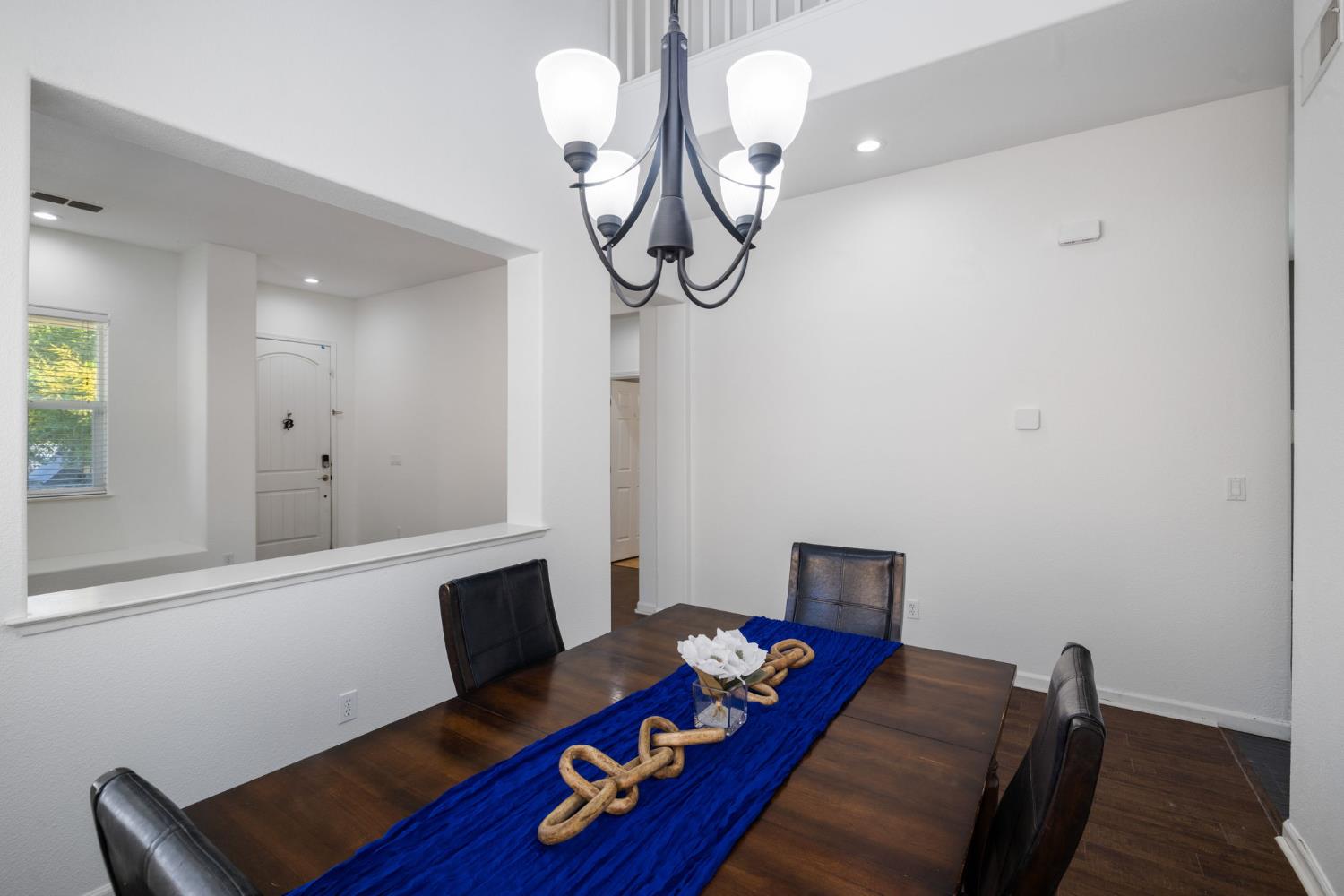 562 Ranger Street Oakdale, CA 95361 - Photo 16 of 63 Dining room featuring dark wood finished floors, recessed lighting, with chandelier