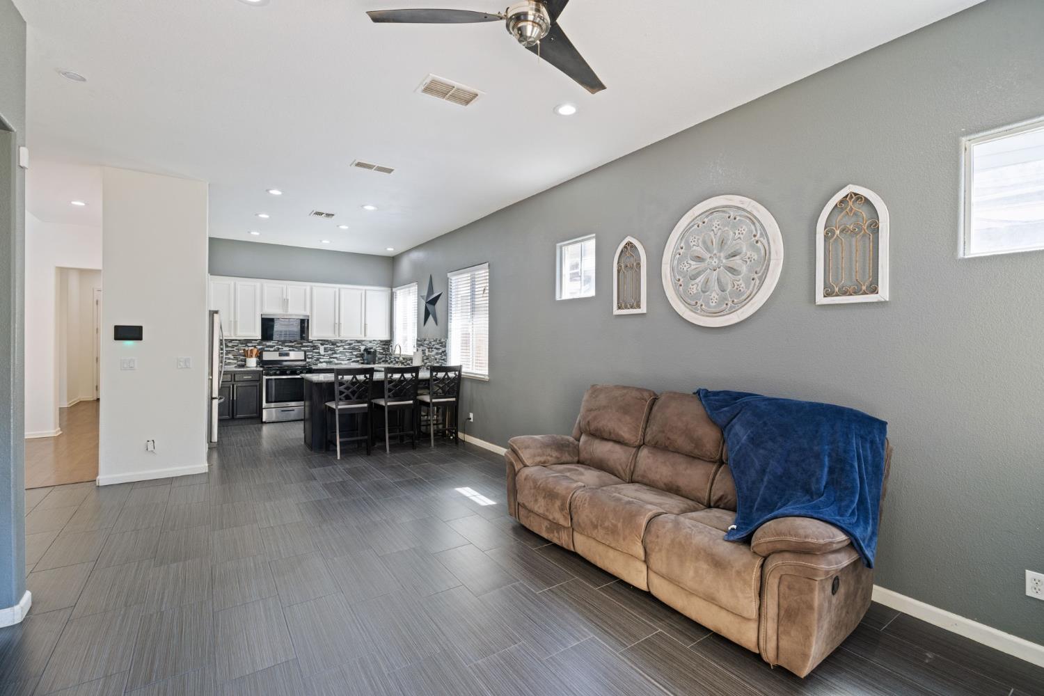 562 Ranger Street Oakdale, CA 95361 - Photo 21 of 63 Family room featuring a ceiling fan, recessed lighting, and tile flooring