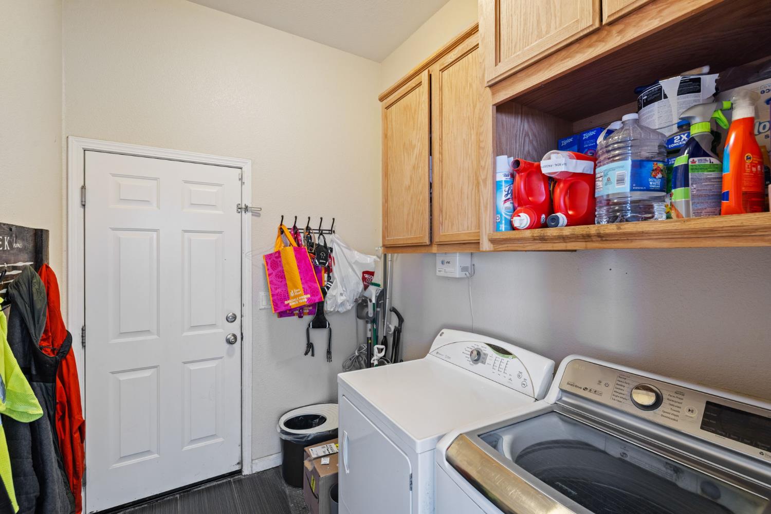 562 Ranger Street Oakdale, CA 95361 - Photo 29 of 63 Laundry room featuring cabinet space and separate washer and dryer