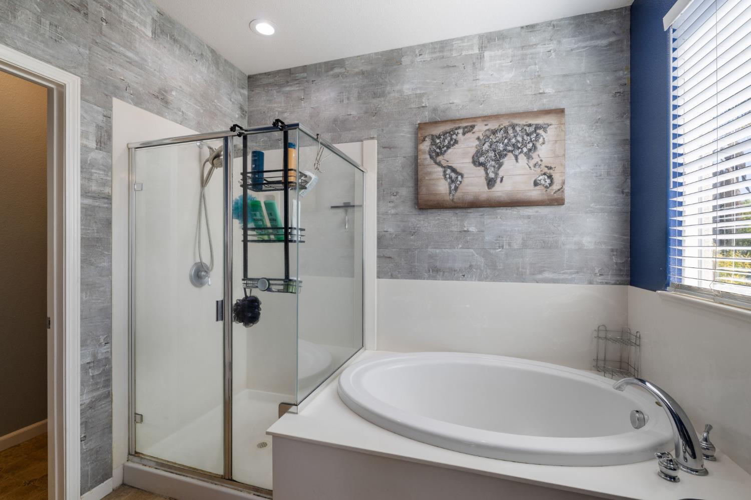 562 Ranger Street Oakdale, CA 95361 - Photo 39 of 63 Master bathroom, with oval tub, a shower stall, and recessed lighting