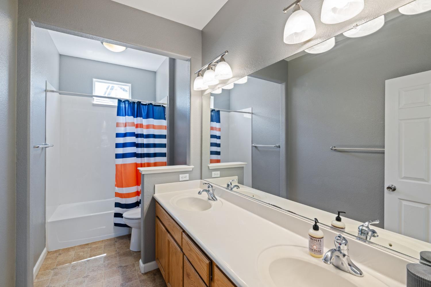 562 Ranger Street Oakdale, CA 95361 - Photo 40 of 63 Upstairs full bath featuring shower / tub combo and double vanity