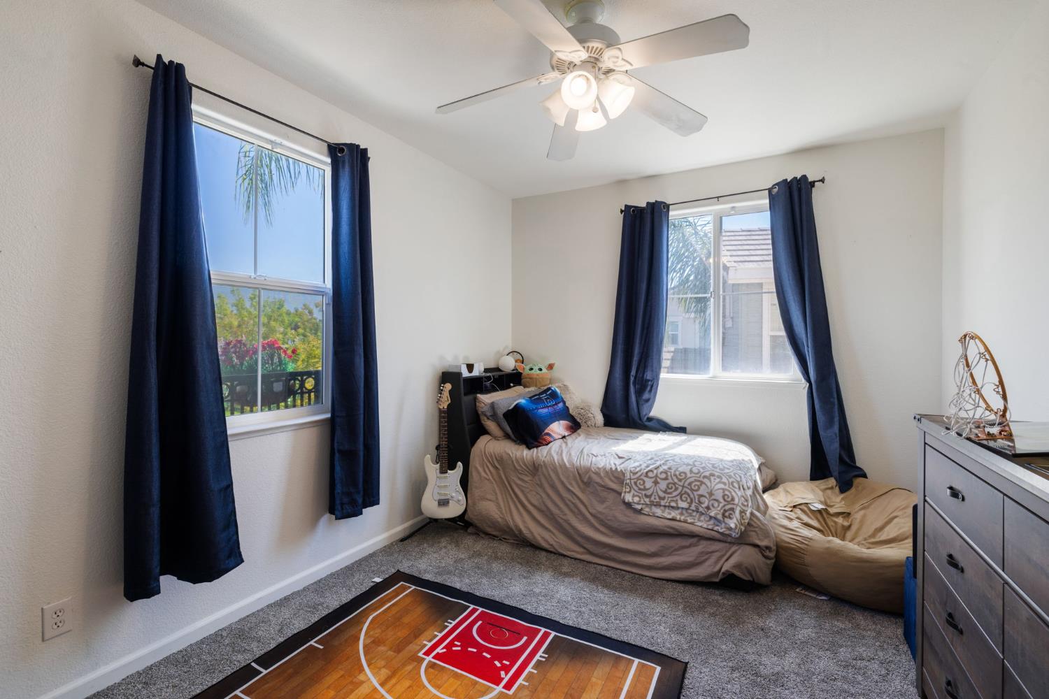 562 Ranger Street Oakdale, CA 95361 - Photo 42 of 63 Upstairs bedroom with ceiling fan and plenty of natural lighting.