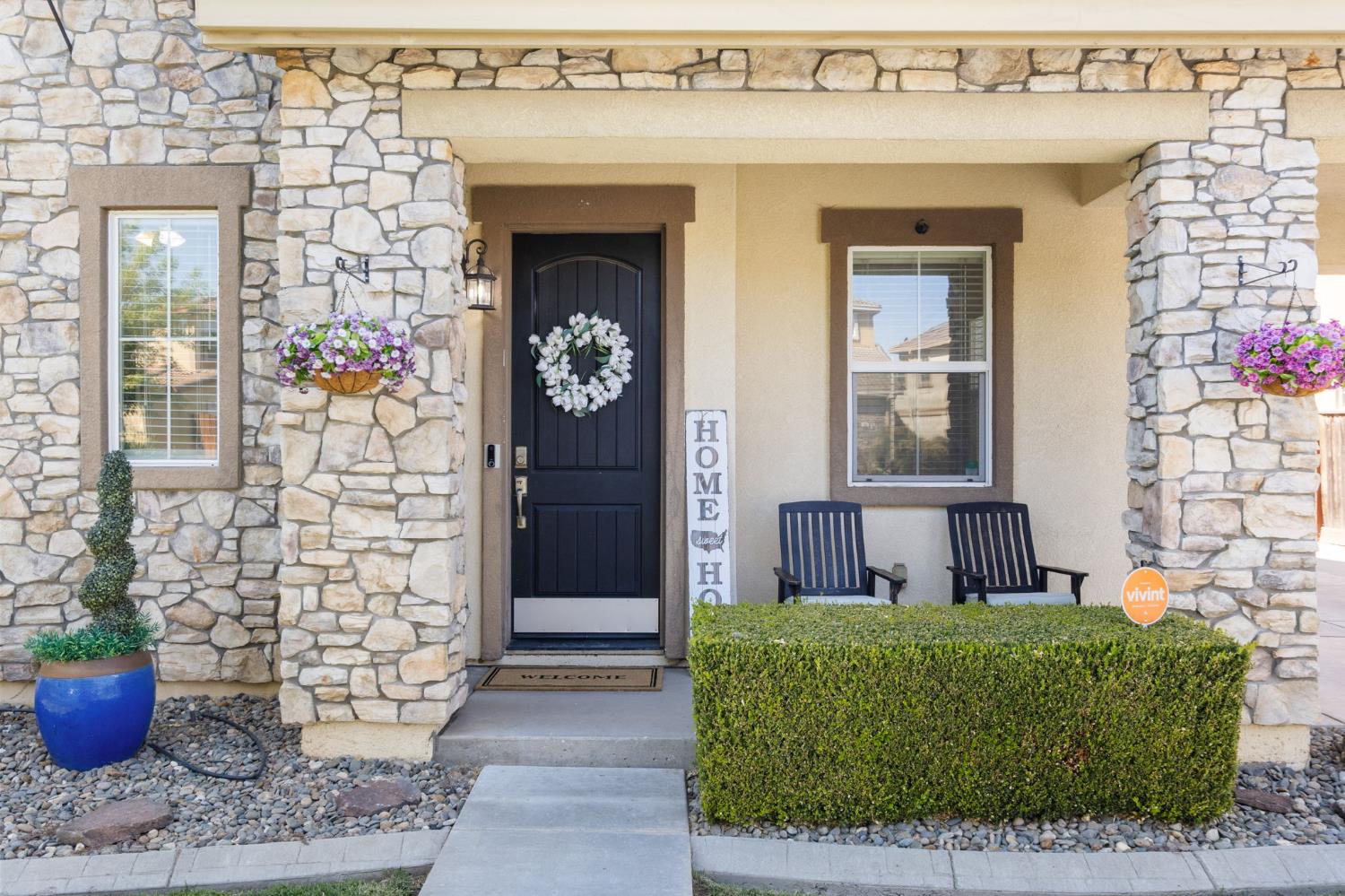 562 Ranger Street Oakdale, CA 95361 - Photo 5 of 63 view of exterior entry featuring stone siding, covered porch, and stucco siding