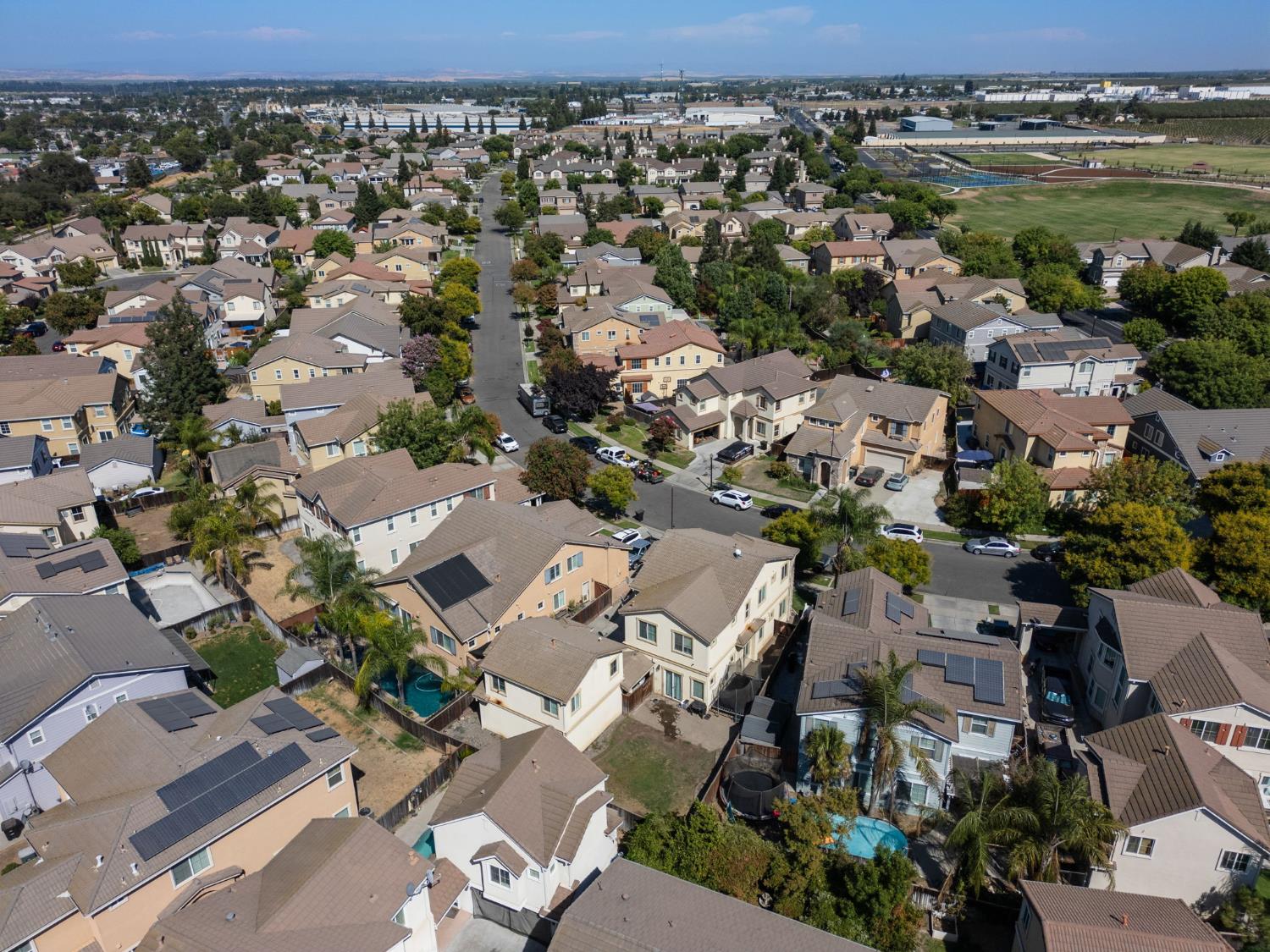 562 Ranger Street Oakdale, CA 95361 - Photo 62 of 63 aerial view of property and surrounding area featuring nearby suburban area