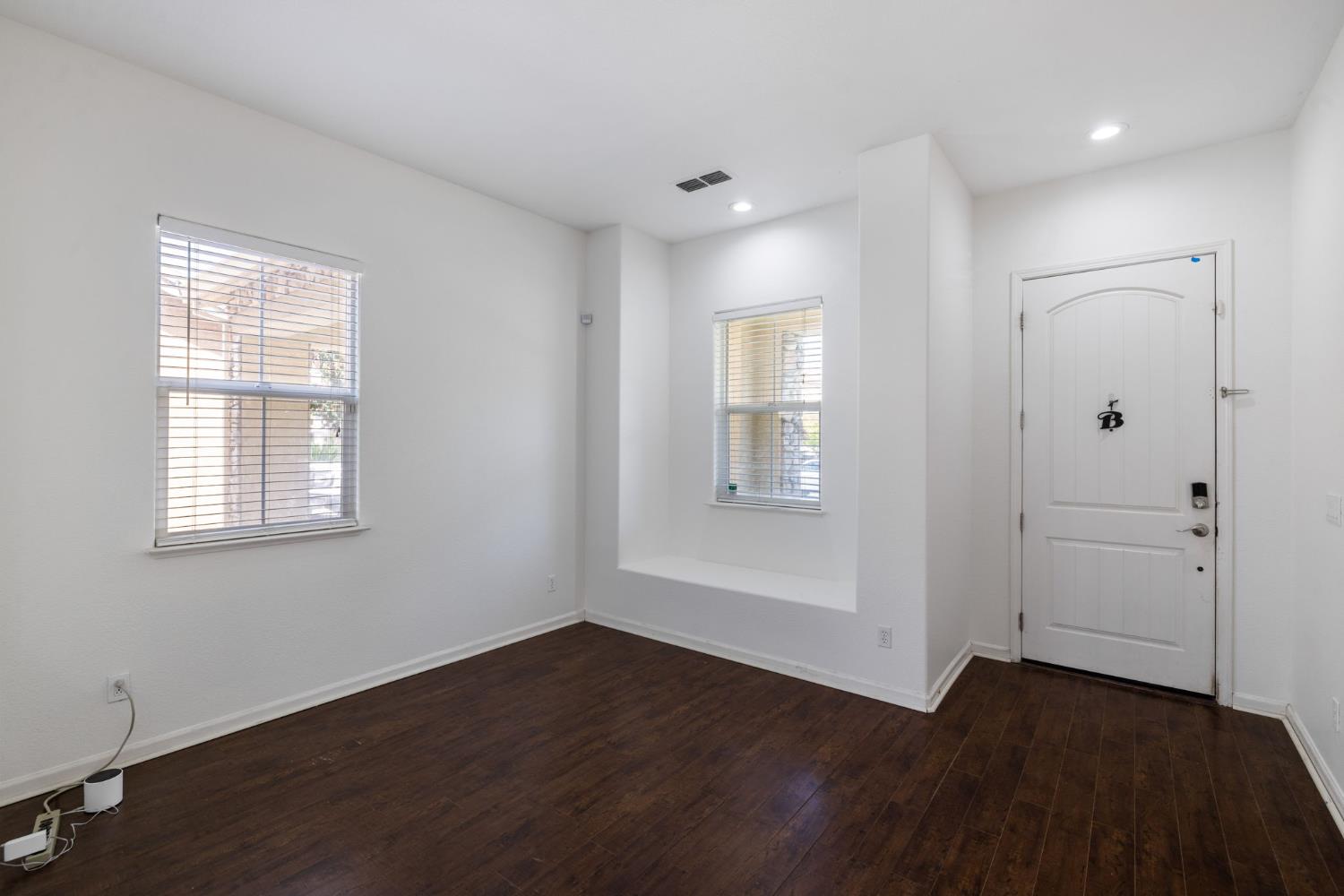 562 Ranger Street Oakdale, CA 95361 - Photo 10 of 63 Living room featuring dark wood finished floors and recessed lighting. Window seat viewing front street.