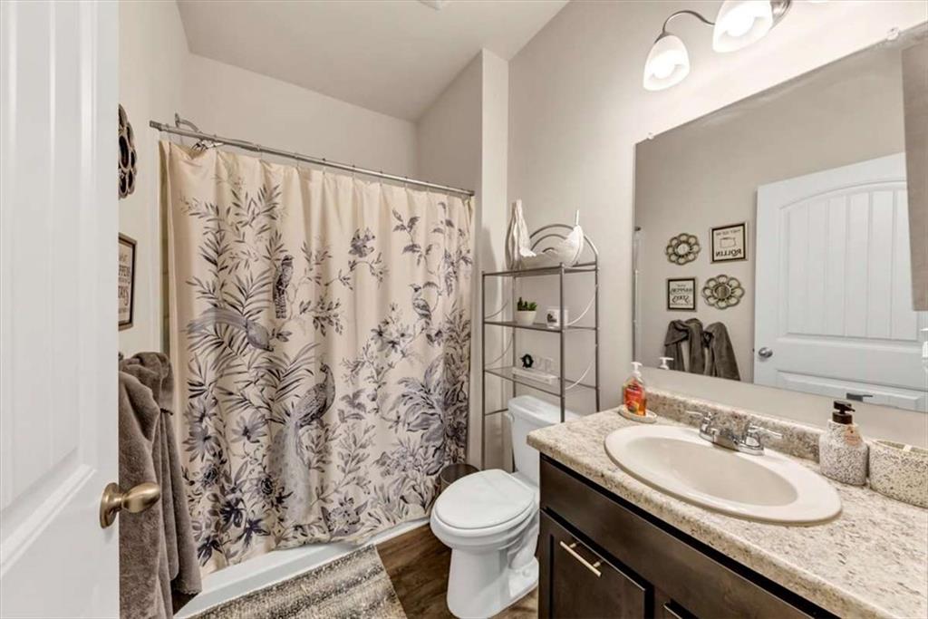 3737 Makeover Court Atlanta, GA 30349 - Photo 16 of 34 a bathroom with a granite countertop sink toilet and shower