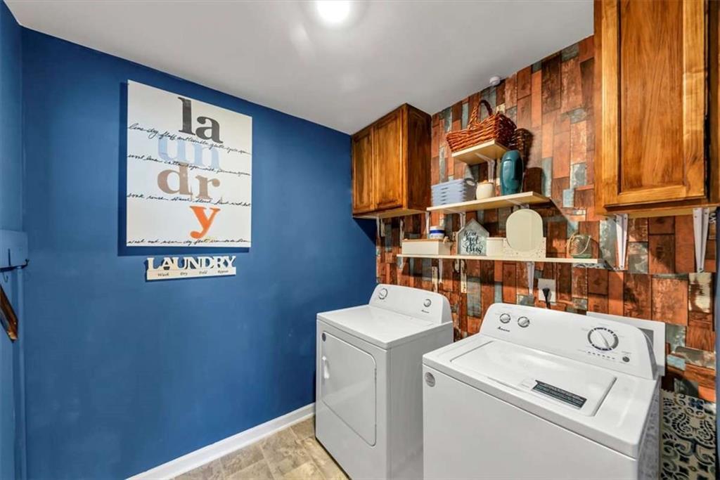 3737 Makeover Court Atlanta, GA 30349 - Photo 25 of 34 a utility room with dryer and washer