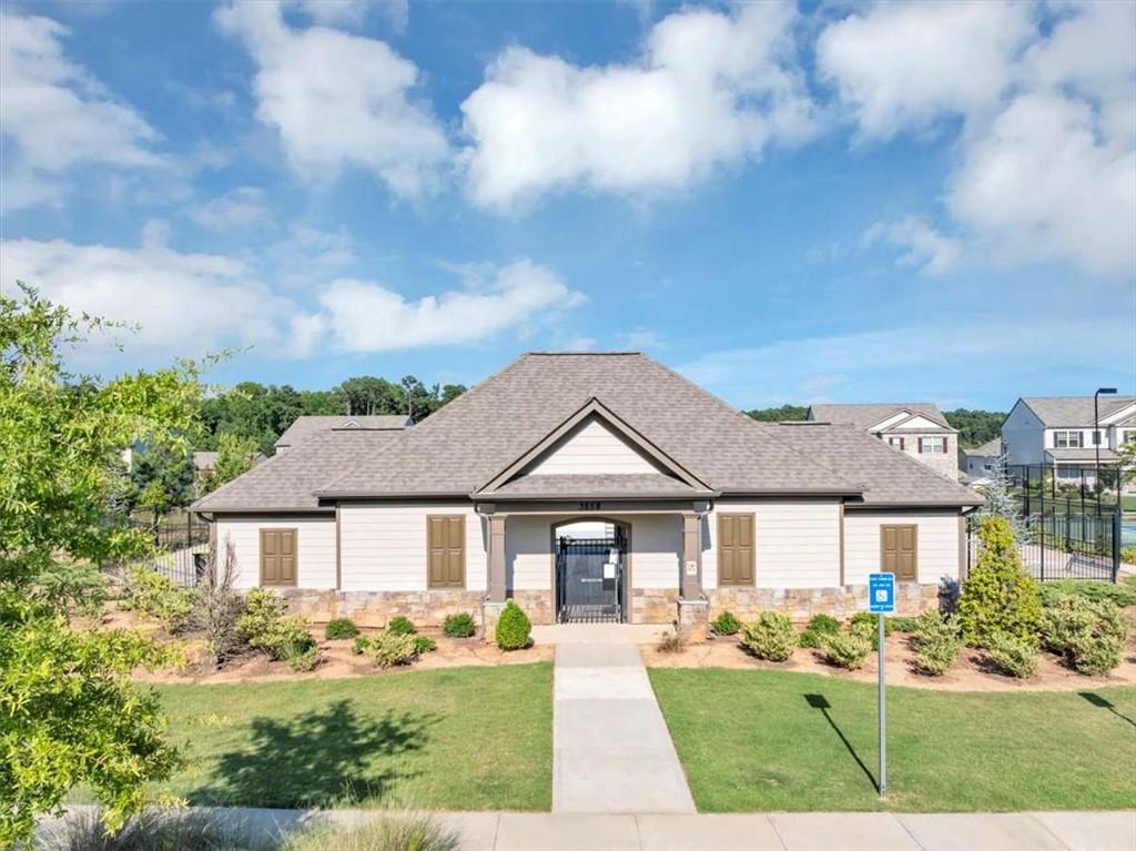 3737 Makeover Court Atlanta, GA 30349 - Photo 33 of 34 a front view of a house with garden