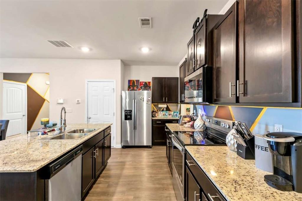 3737 Makeover Court Atlanta, GA 30349 - Photo 9 of 34 a kitchen with lots of counter space