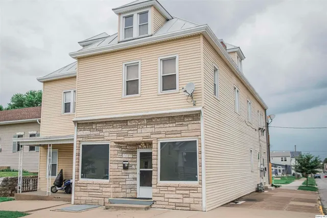 a view of a house with a small garden