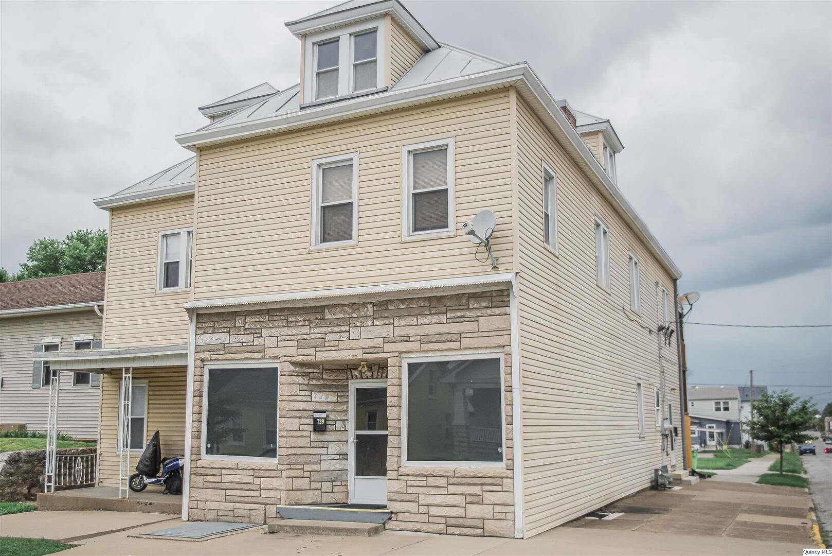 a view of a house with a small garden