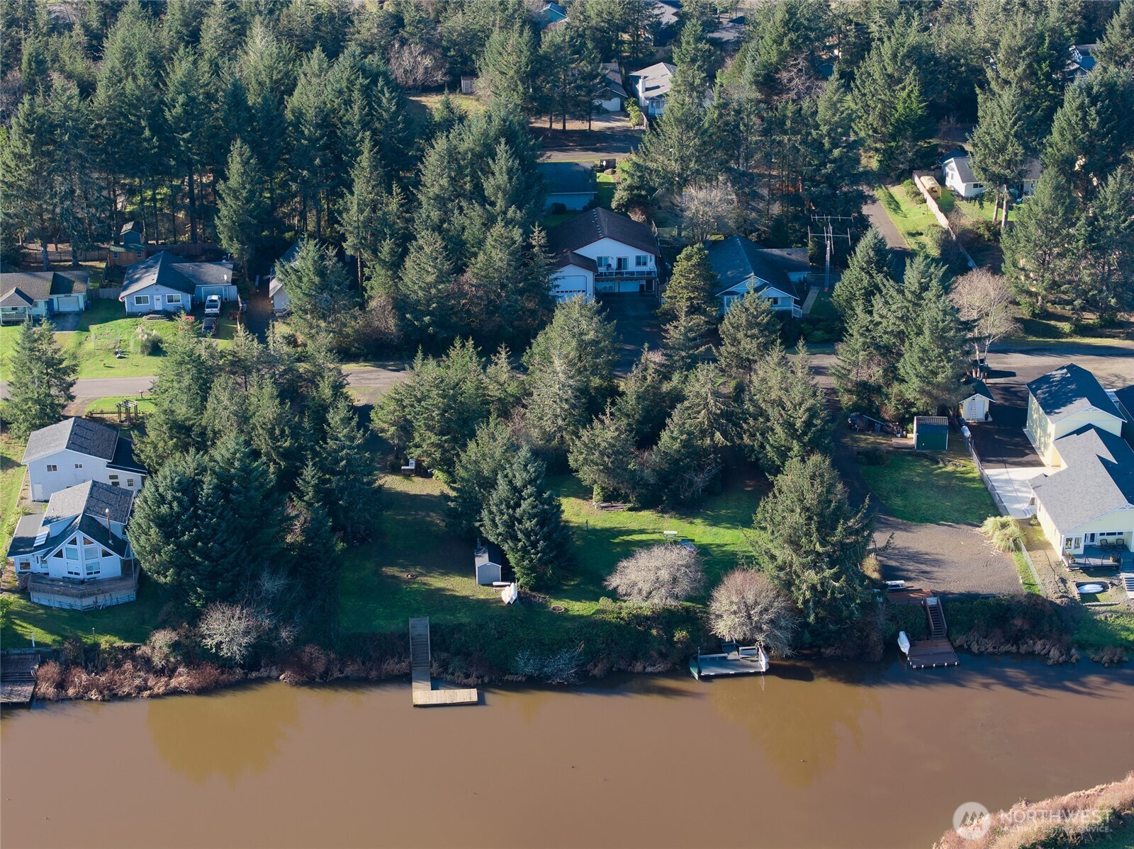 636 Weatherwax Loop Northeast Ocean Shores, WA 98569 - Photo 26 of 32 an aerial view of a house with a yard basket ball court and outdoor seating