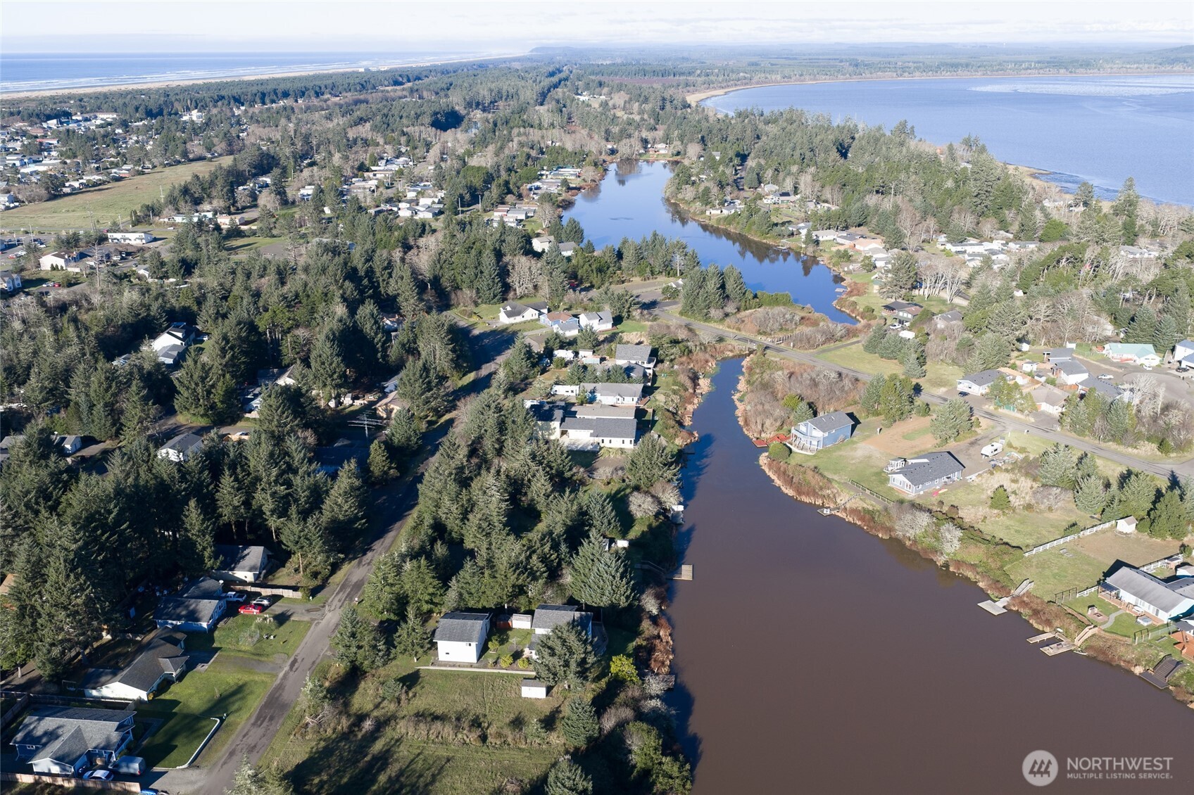 636 Weatherwax Loop Northeast Ocean Shores, WA 98569 - Photo 29 of 32 an aerial view of a city with lots of residential buildings