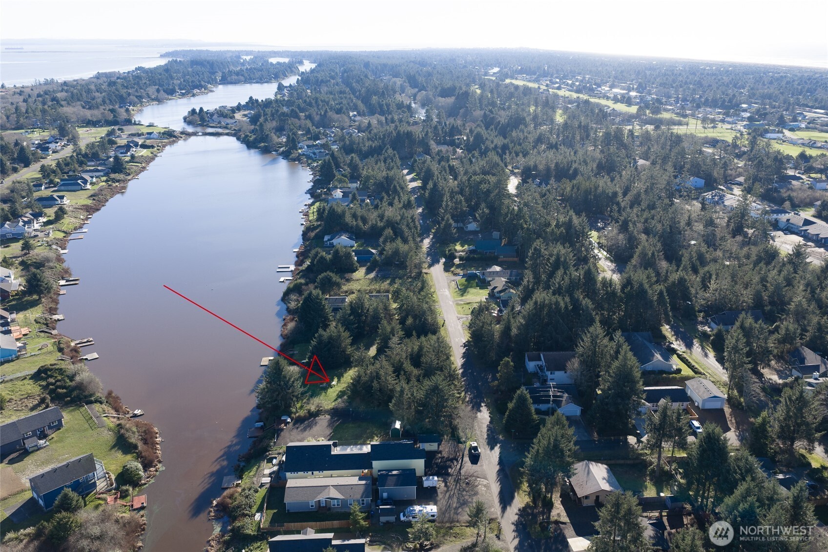 636 Weatherwax Loop Northeast Ocean Shores, WA 98569 - Photo 30 of 32 an aerial view of multiple house
