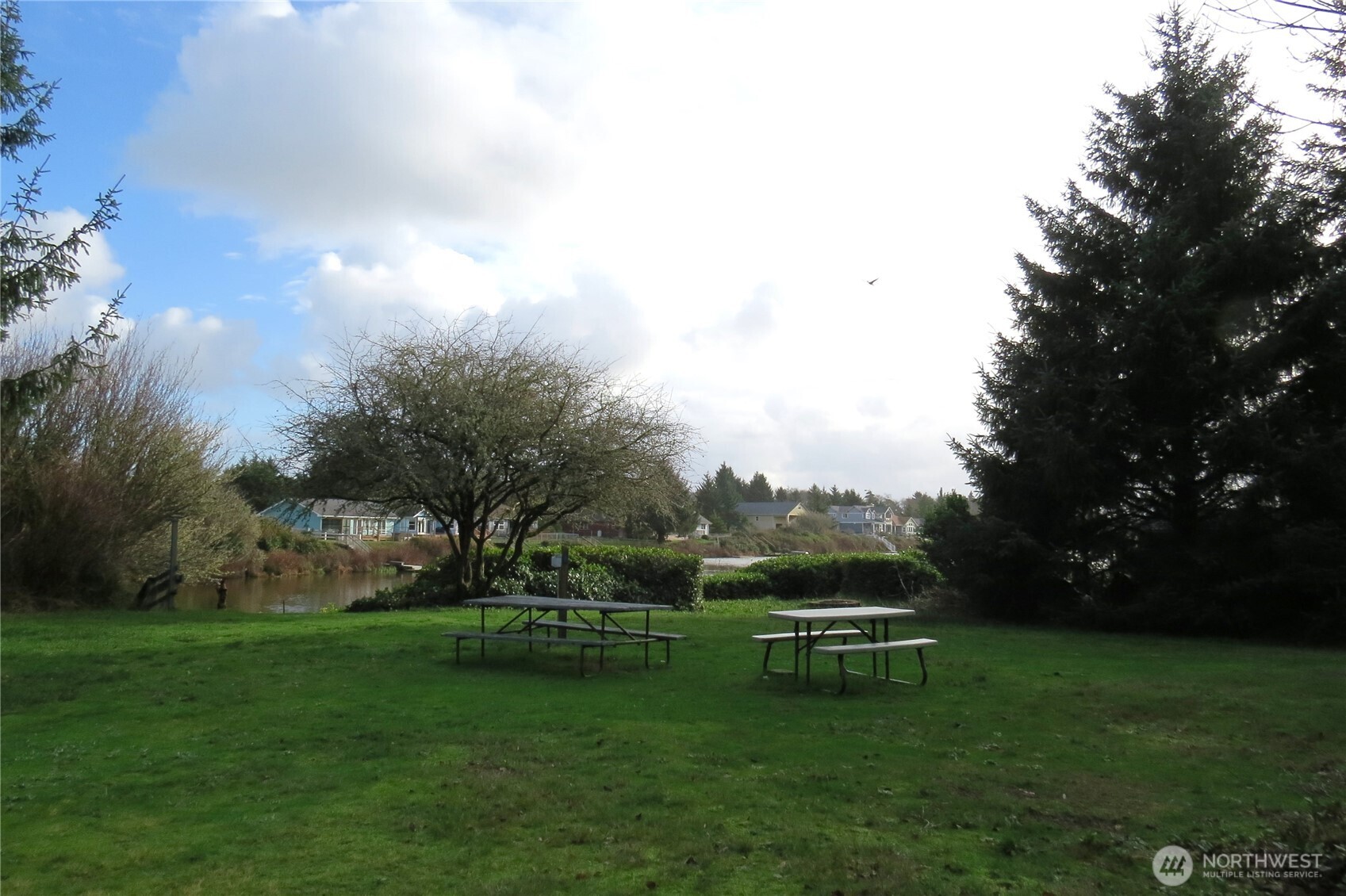 636 Weatherwax Loop Northeast Ocean Shores, WA 98569 - Photo 4 of 32 a view of house with backyard space and garden