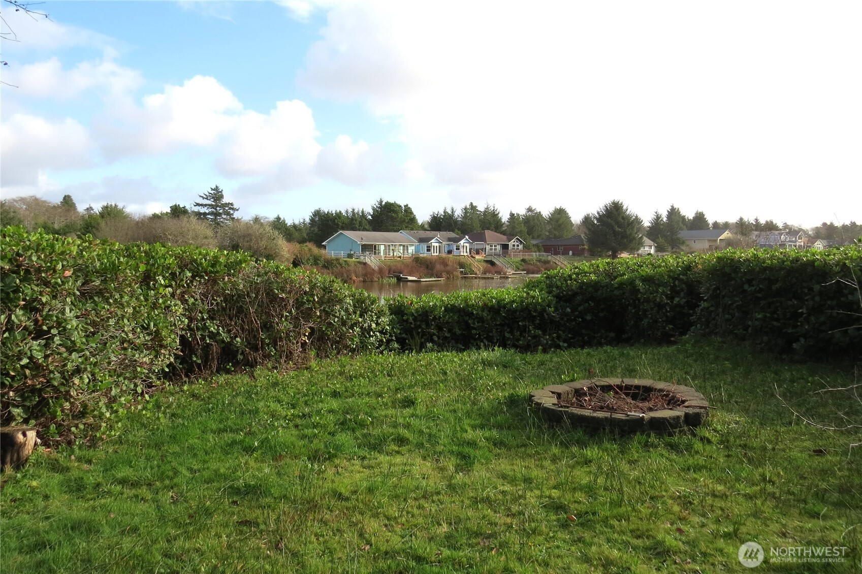 636 Weatherwax Loop Northeast Ocean Shores, WA 98569 - Photo 5 of 32 a view of a backyard