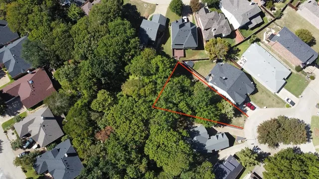 an aerial view of multiple houses with yard